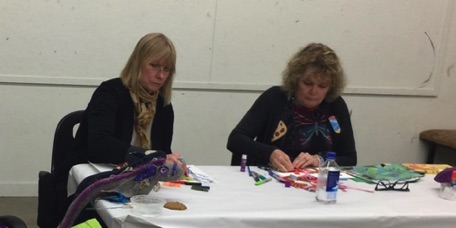 Verletta Russell and Susie Games concentrate of art making